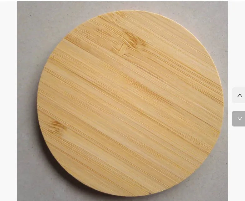 Square bamboo wood 5W wireless charger on a wooden surface.