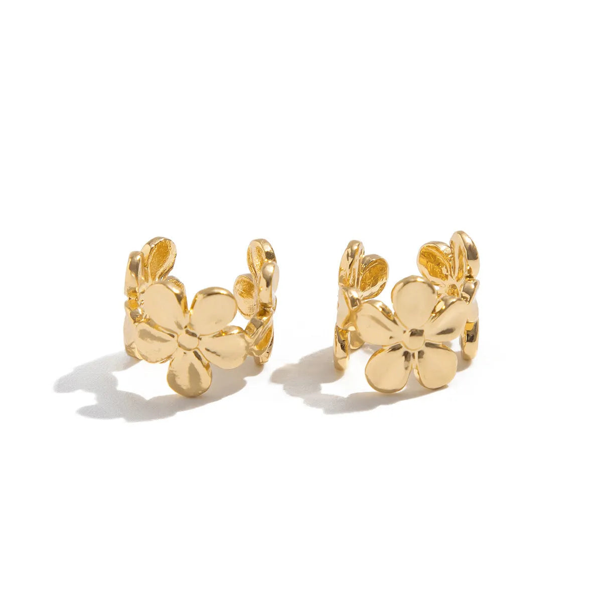 Gold-coloured women's earrings with starfish and conch designs on alloy posts.