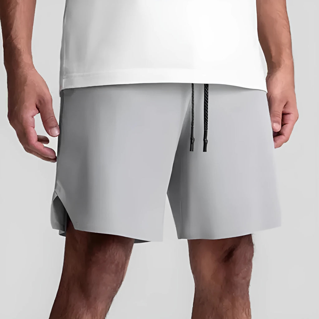 Men's grey seamless sports shorts with quick-drying fabric and straight knee-length cut