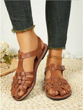 Dark brown women's vintage weave sandals with closed toe and buckle strap.
