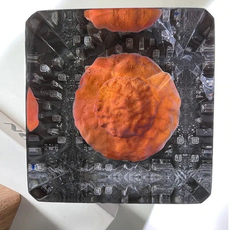 Small atomic bomb mushroom cloud shaped resin night lamp decoration in two colour variants on a dark surface.