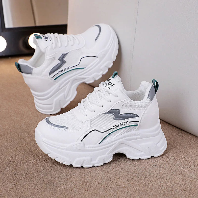 Women's white breathable dad shoes with lace-up front and cross shoulder strap on a rubber sole.