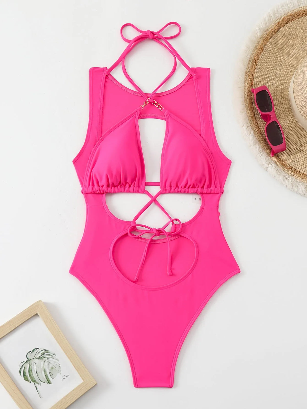 Bright pink one-piece swimsuit with cutout strap, nylon fabric and lining, sizes S M L for women