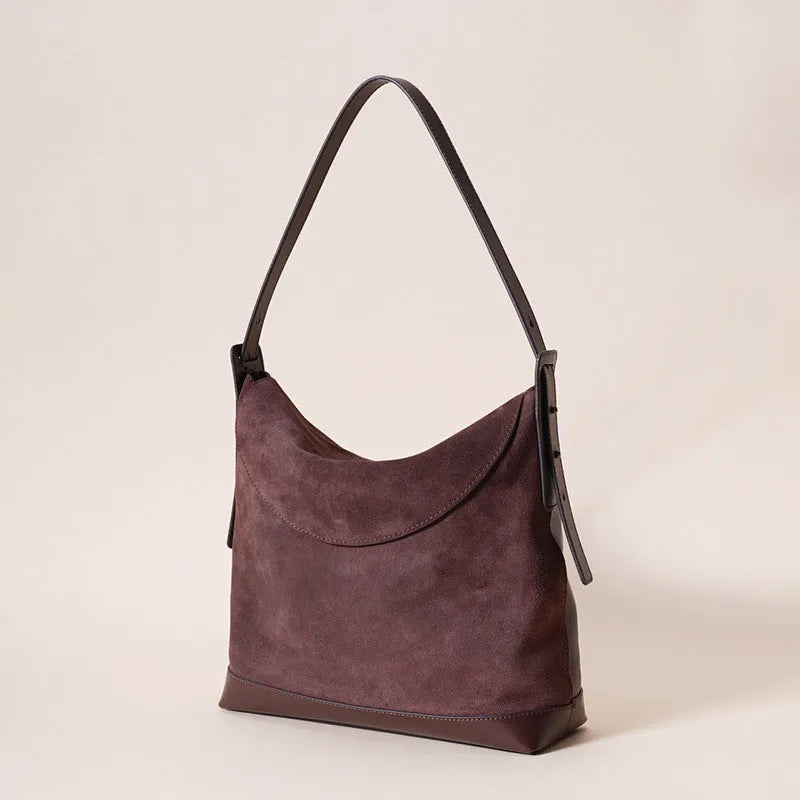 Light brown genuine leather retro style women's shoulder bag with clamshell opening.