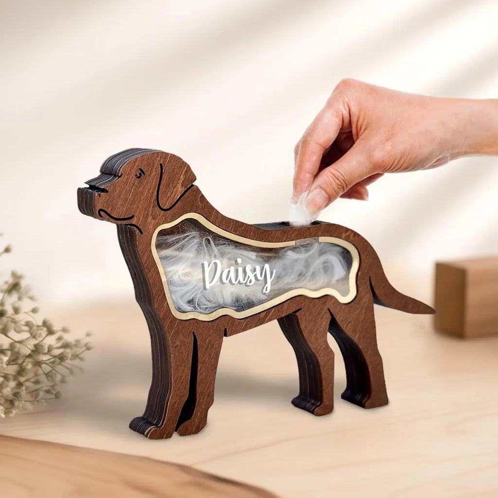 Black rectangular wooden box with a sliding lid for storing pet grooming tools.