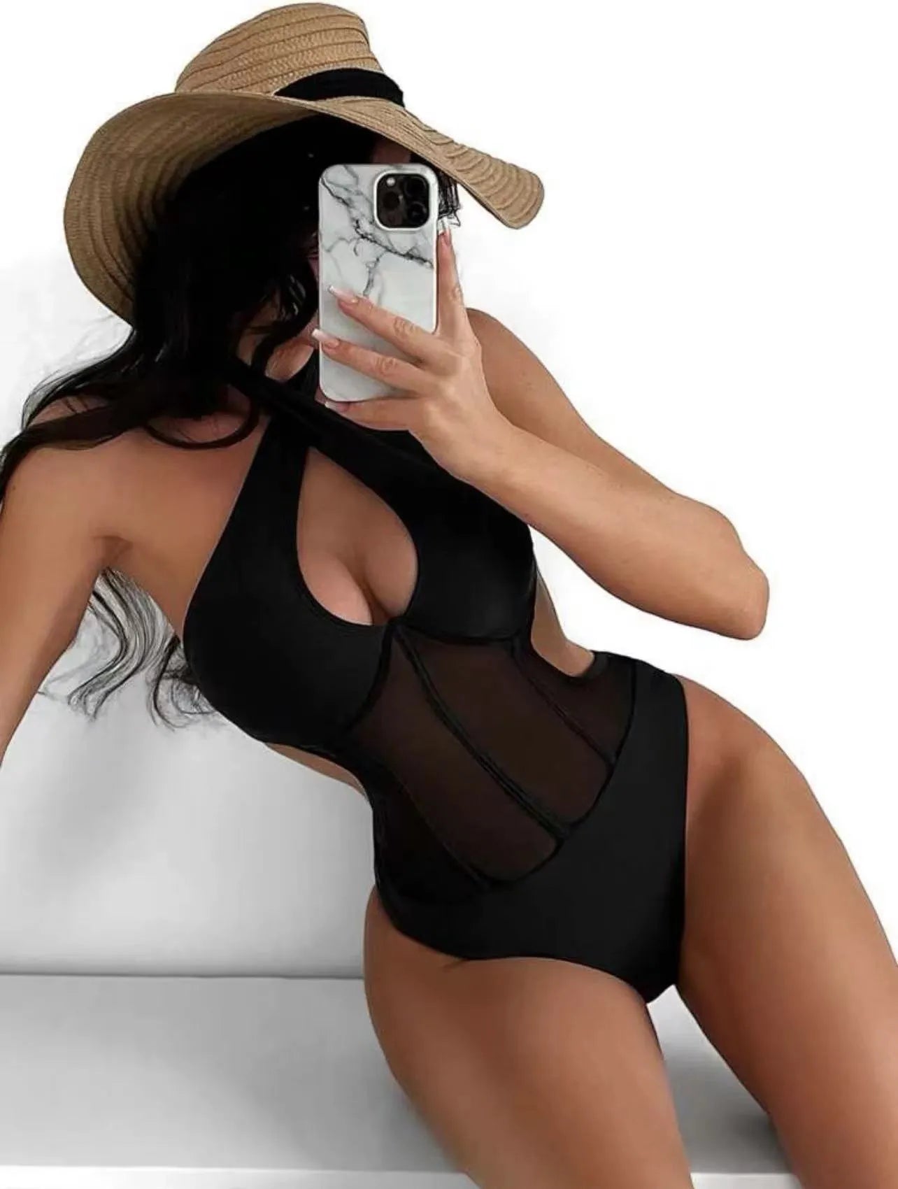 Women's black one-piece bikini swimsuit made from nylon and spandex fabric on a mannequin