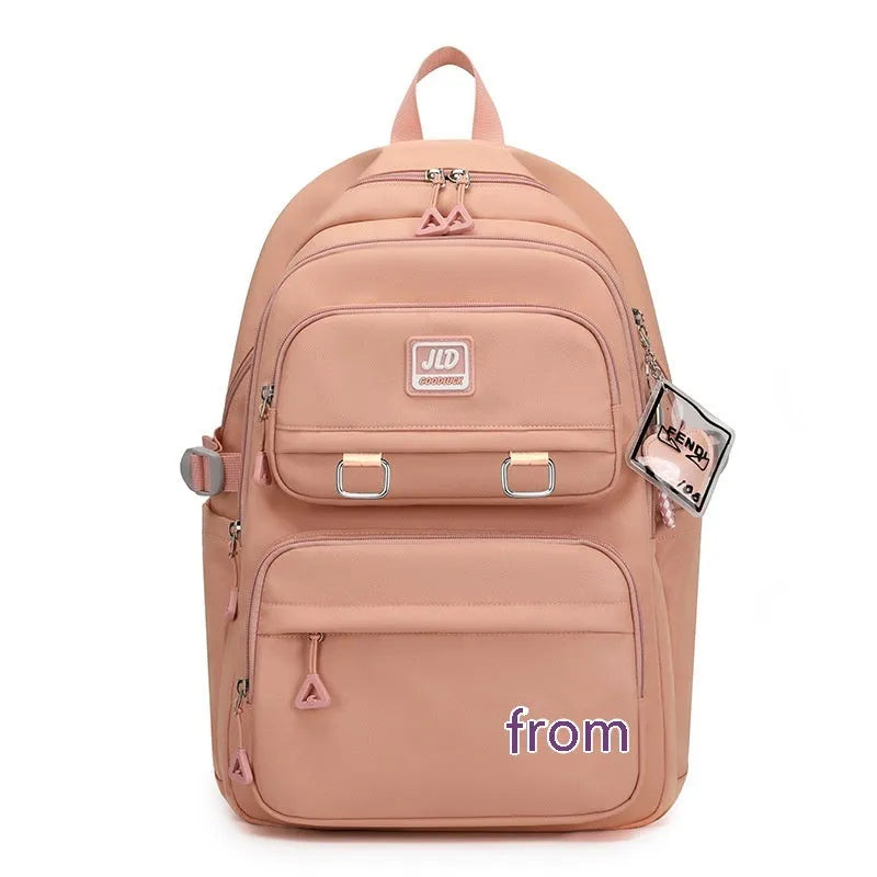 Girls' large capacity nylon school backpack in a selection of colours and graphic patterns on a physiological curve backplane.