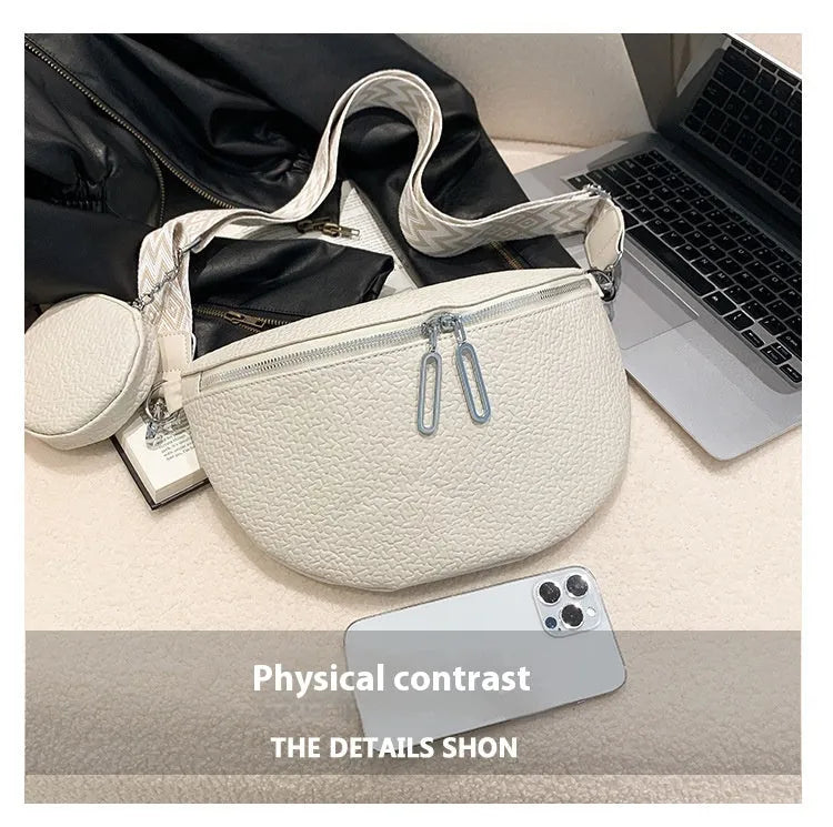 Solid colour women's crossbody bag with horizontal square clamshell design and zip closure