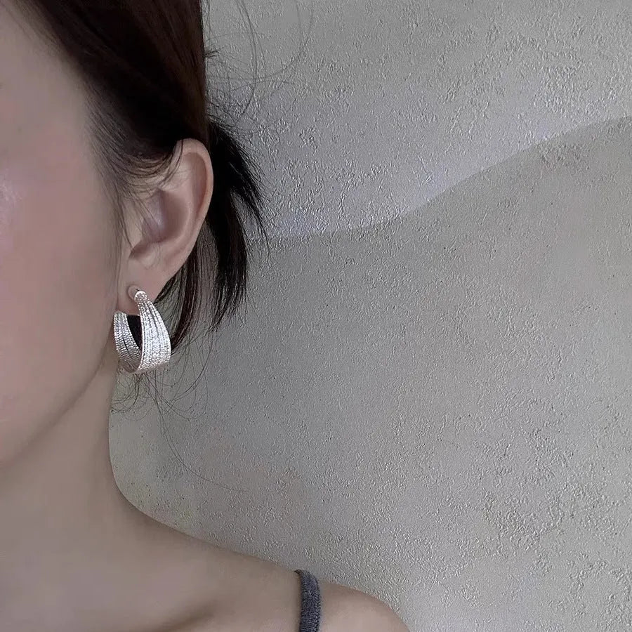 Geometric layered bracelet earrings with matching stud and clip earrings in gold or silver finishes