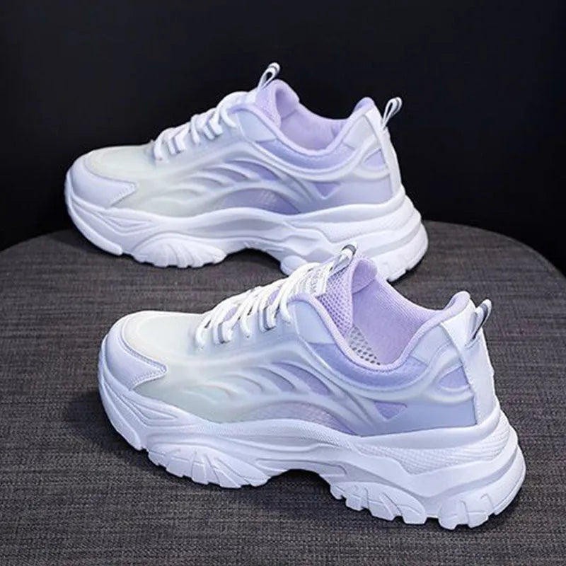 Women's casual shoes with satin upper in blue colour showing round toe and lace-up design