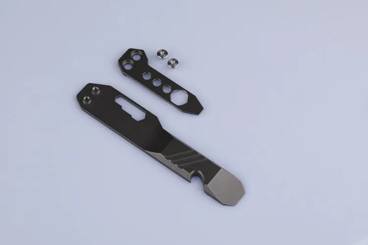 Titanium alloy multi-function crowbar tool with screwdriver tip and bottle opener in stone wash finish.