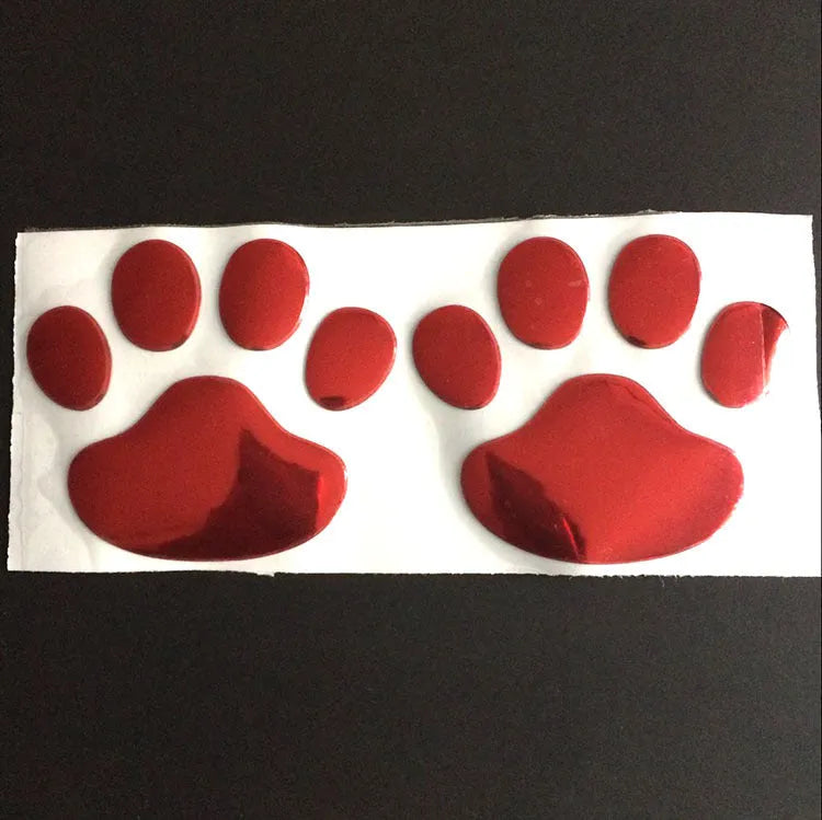 PVC dog footprint car sticker showing hand-shaped brush design on vehicle bumper