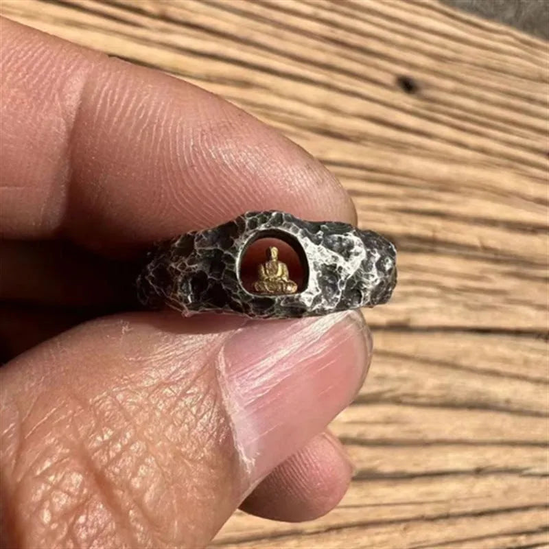Close-up of a hand-forged copper Buddha ring with a grotto rock texture, shown in size UK 8.