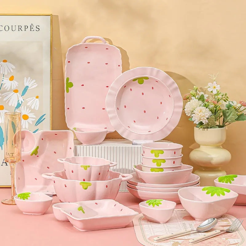Cute strawberry-themed porcelain dinnerware set with flower bowl, fish dish, plates, and spoon.