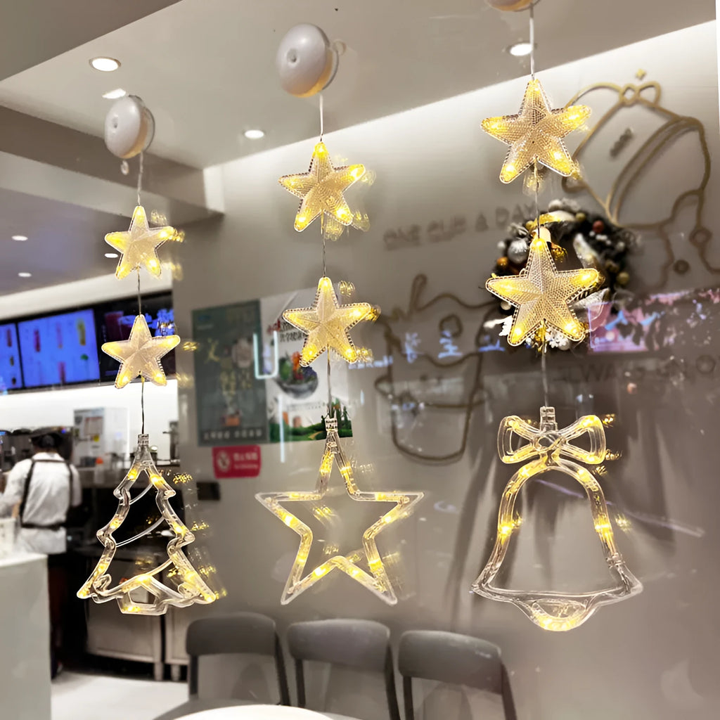 Christmas LED window light with suction cups showing deer, bell, and tree designs