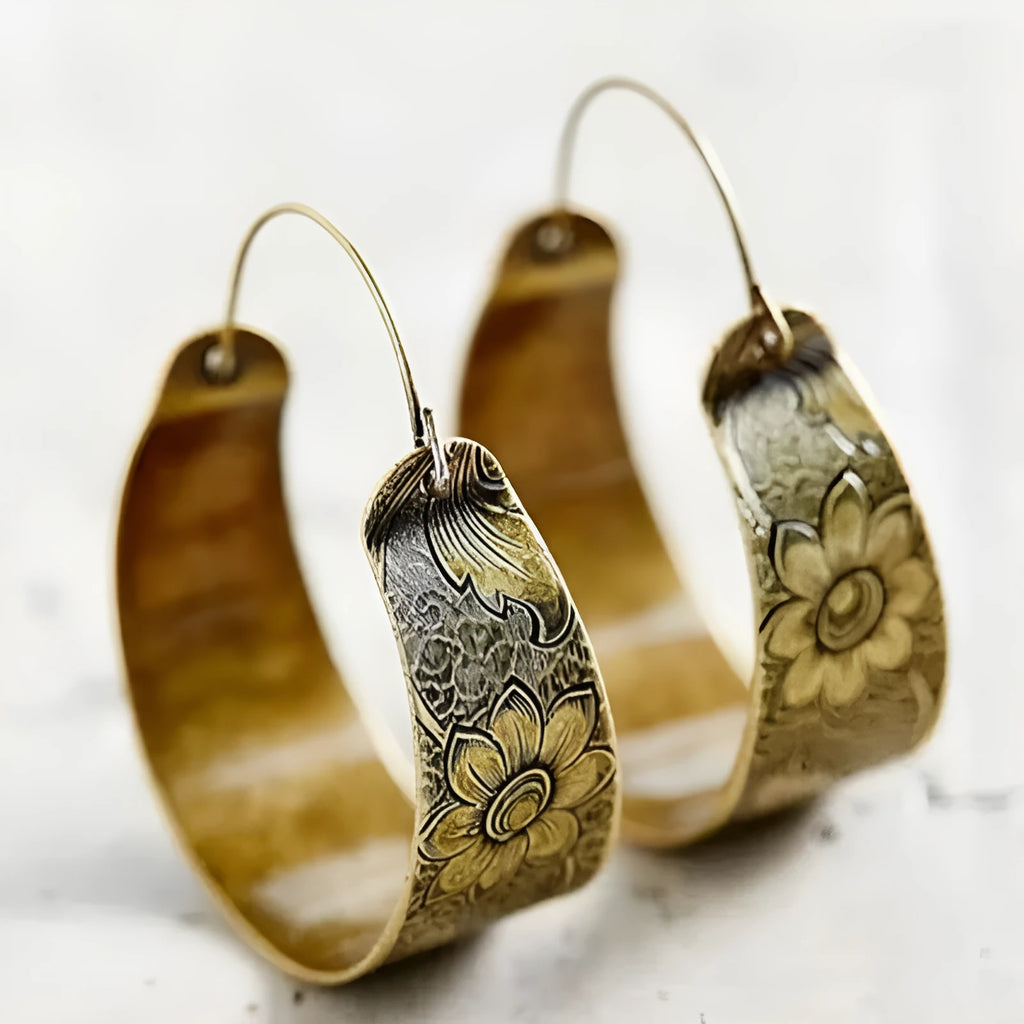 Gold geometric earrings with hollow petal pattern design