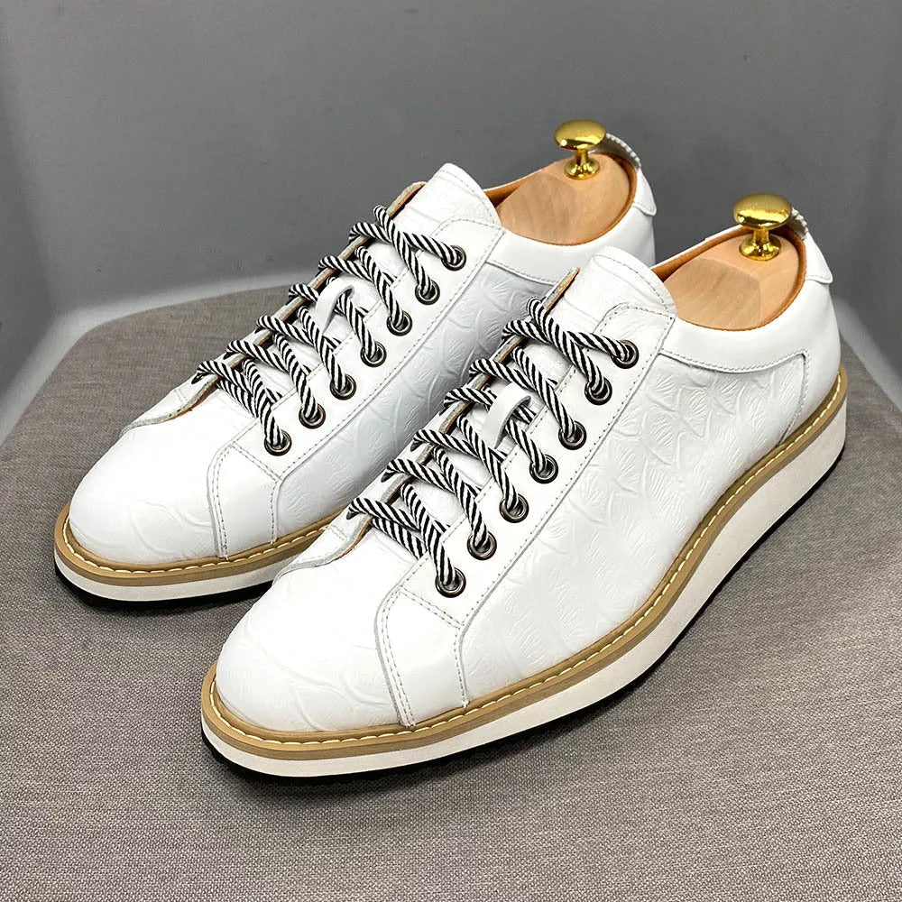 Men's white low-top lace-up shoes with an embossed patterned upper, shown on a plain background.