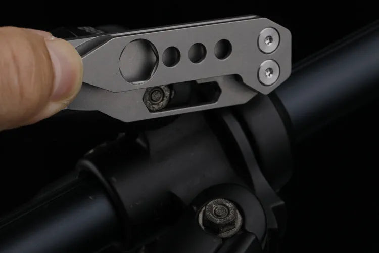 Titanium alloy multi-function crowbar tool with screwdriver tip and bottle opener in stone wash finish.