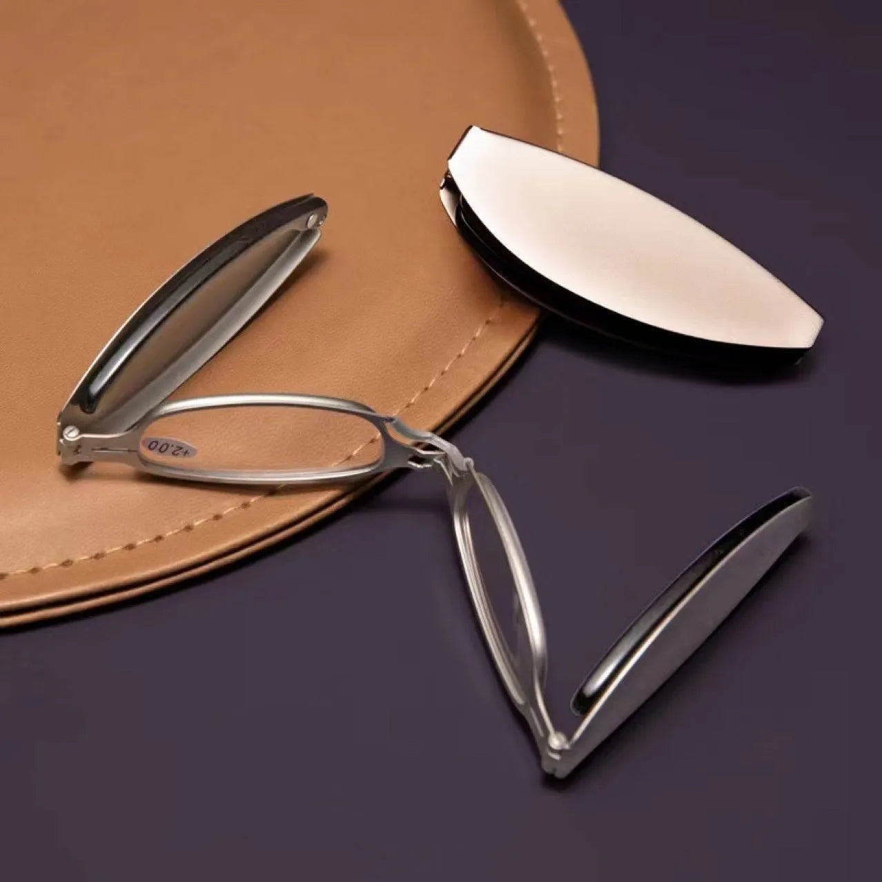 Folding presbyopic reading glasses in retro style with ring detailing, shown in black frame