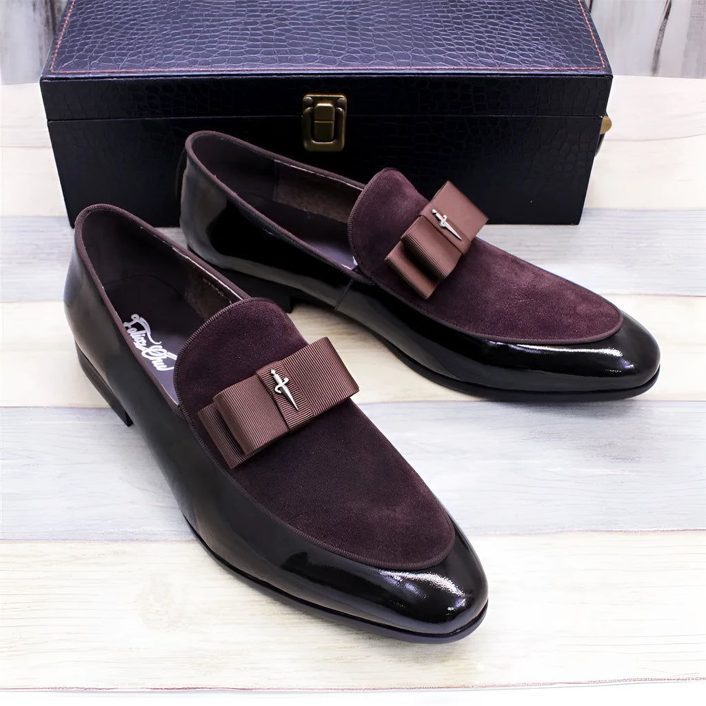 Men's low-top patent leather shoes in black with a tassel detail and rubber sole.