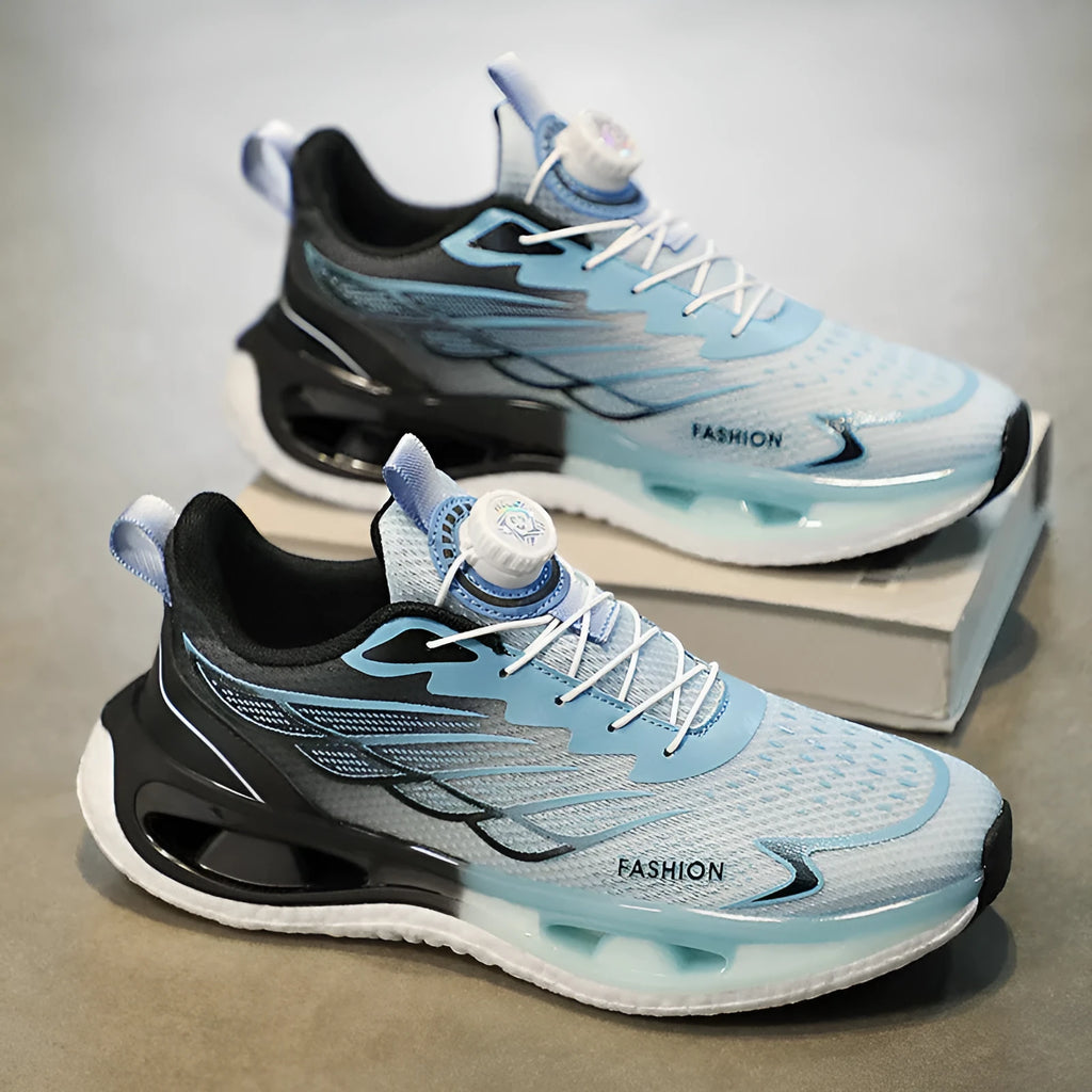 Low-top youth sneaker with rotating button closure in light blue mesh fabric and a non-slip rubber sole.