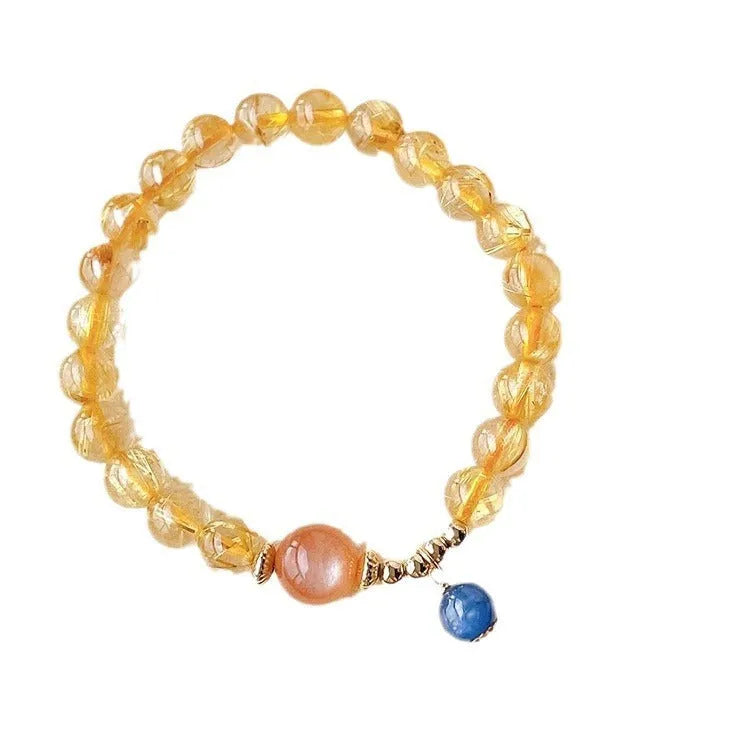 Women's gold rutilated quartz sunstone crystal bracelet with diamond-shaped and round beads