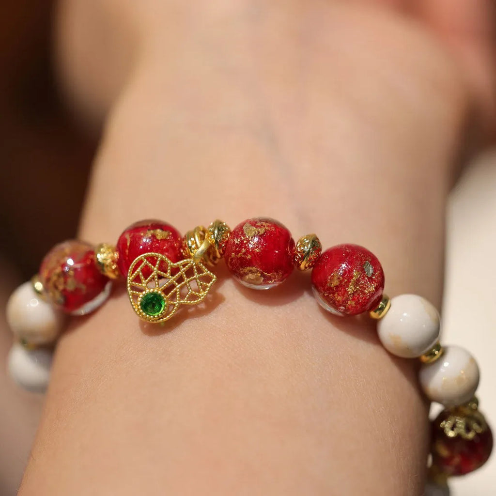 Women's geometric ethnic style bracelet with gold foil coloured glaze and manual glass construction