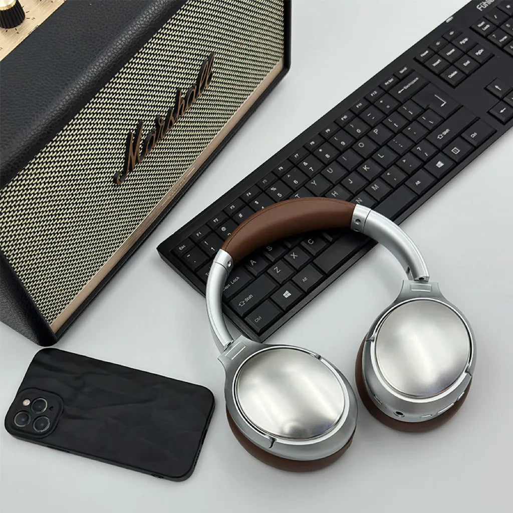 Retro-style brown wireless Bluetooth headset with metal details and sport headband design.