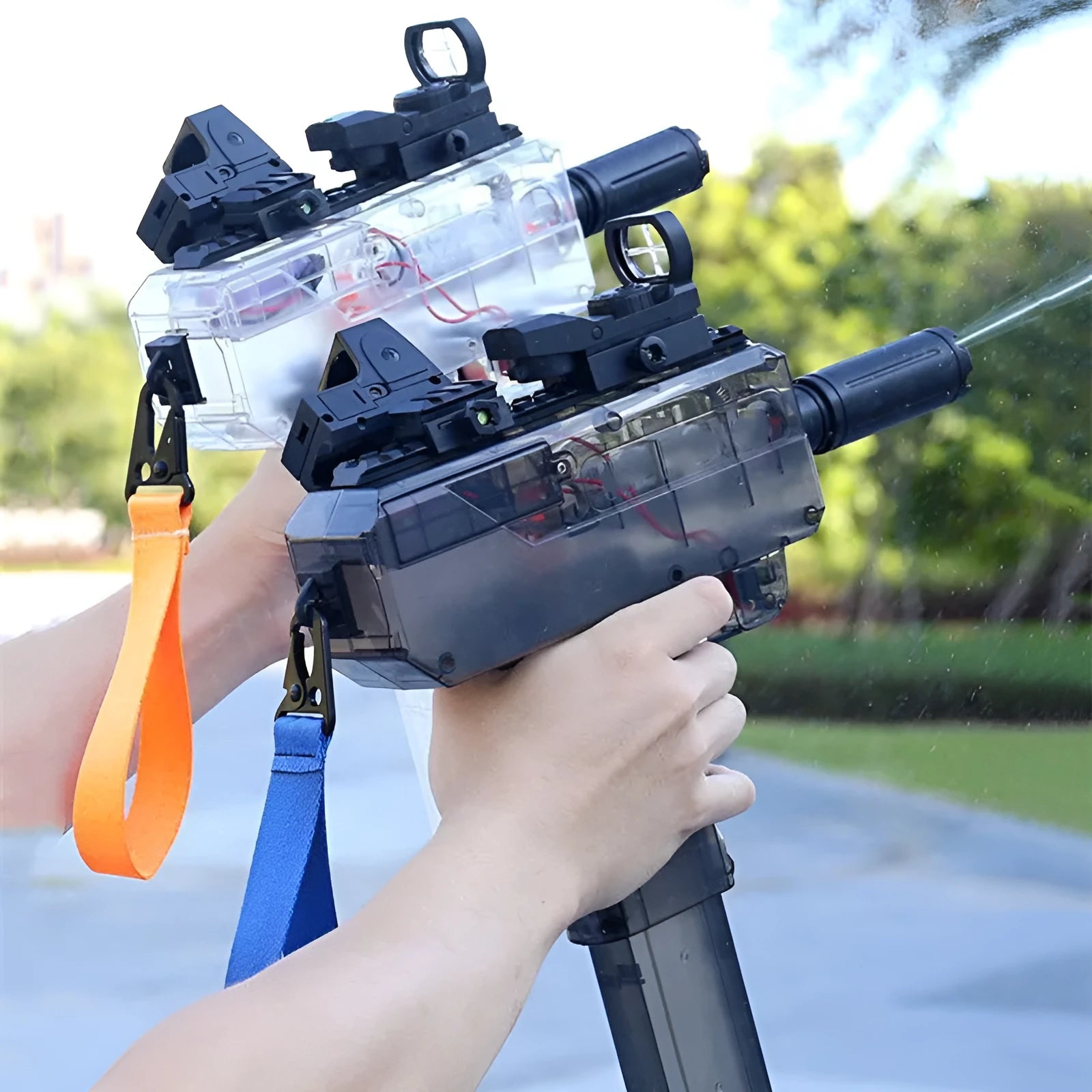 Electric children's water gun with transparent body showing water level, in blue colour with attached accessories.
