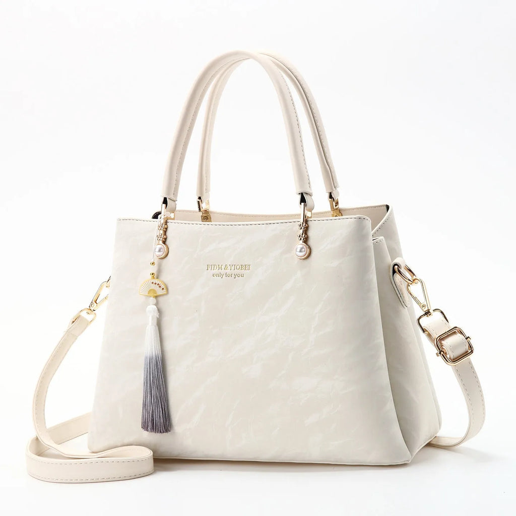 Women's square shoulder bag in PU leather with ethnic detailing and slit pocket