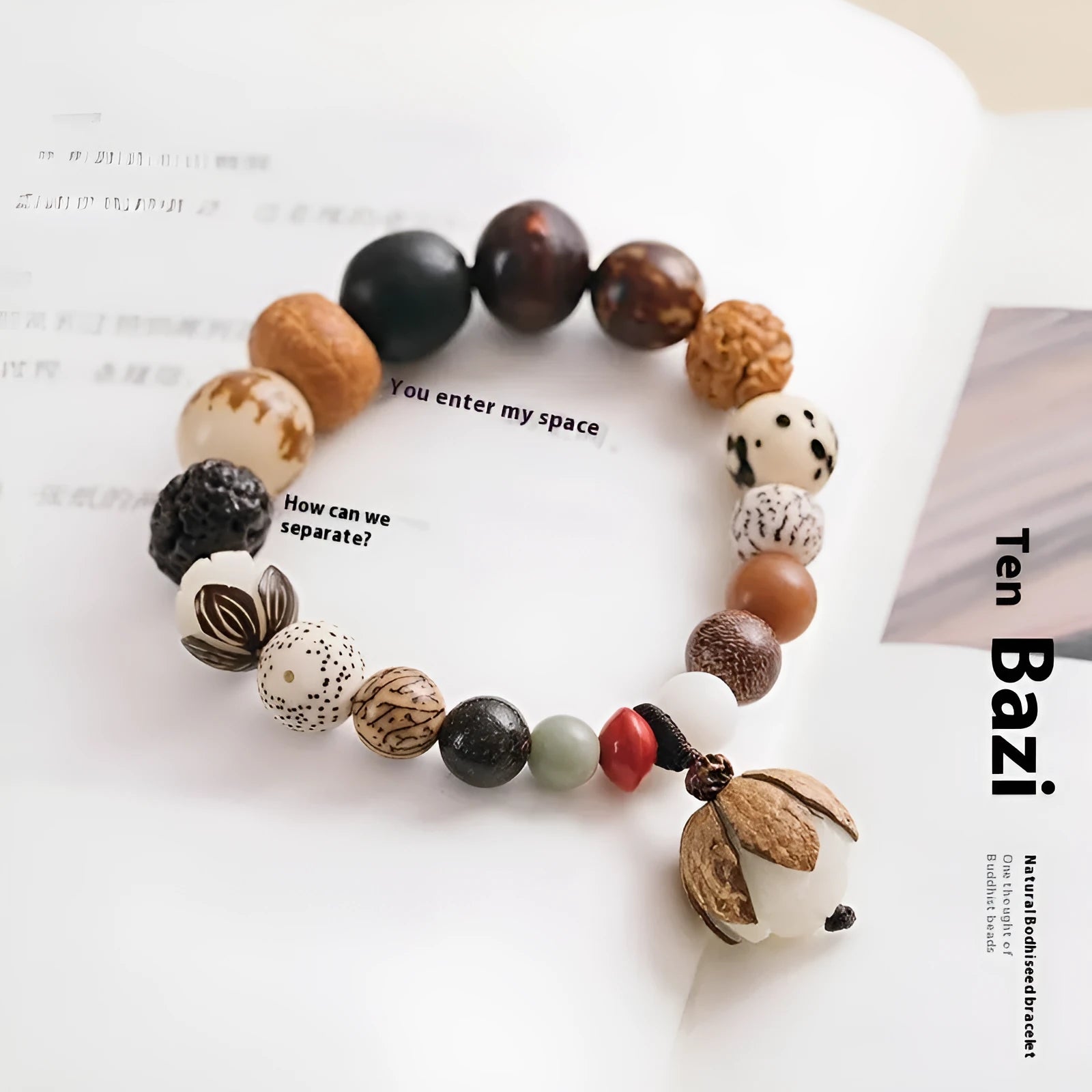 Handmade Bodhi seed bracelet with 18 natural beads on wrist, showing geometric national style design