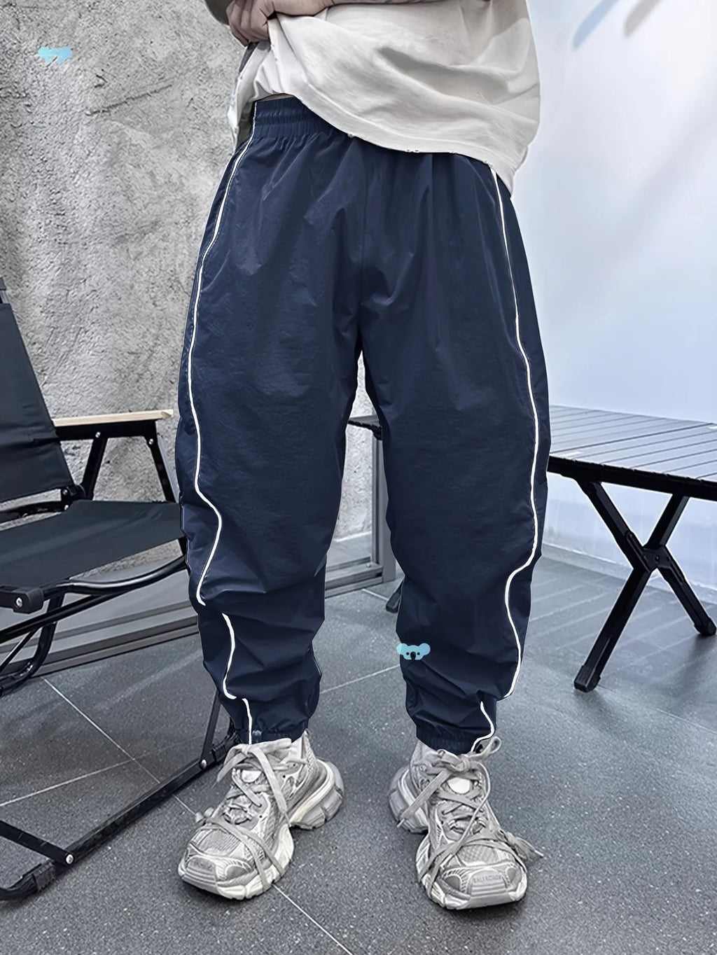 Men's loose fit casual sports trousers in bamboo fibre, shown in cropped length and a colour option like blue.