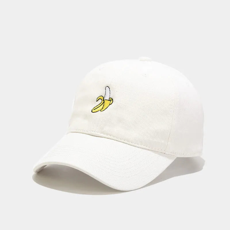 Adjustable black baseball cap with white banana embroidery on the front.