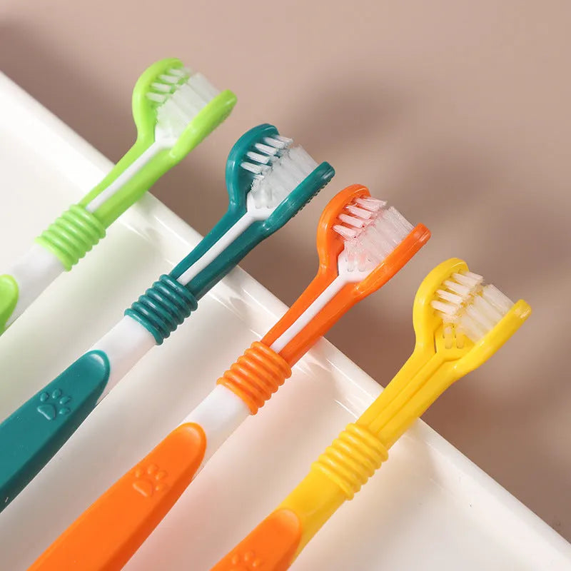 Pet toothbrush oral cleaning product in various colours including orange, green, yellow, blue pink, and black yellow