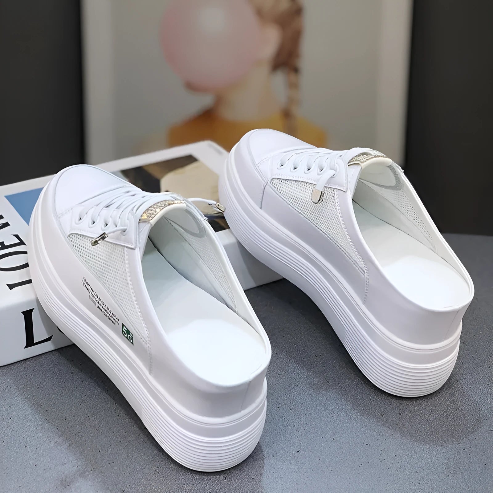 White women's platform shoes with mesh surface and heel-free design on rubber sole