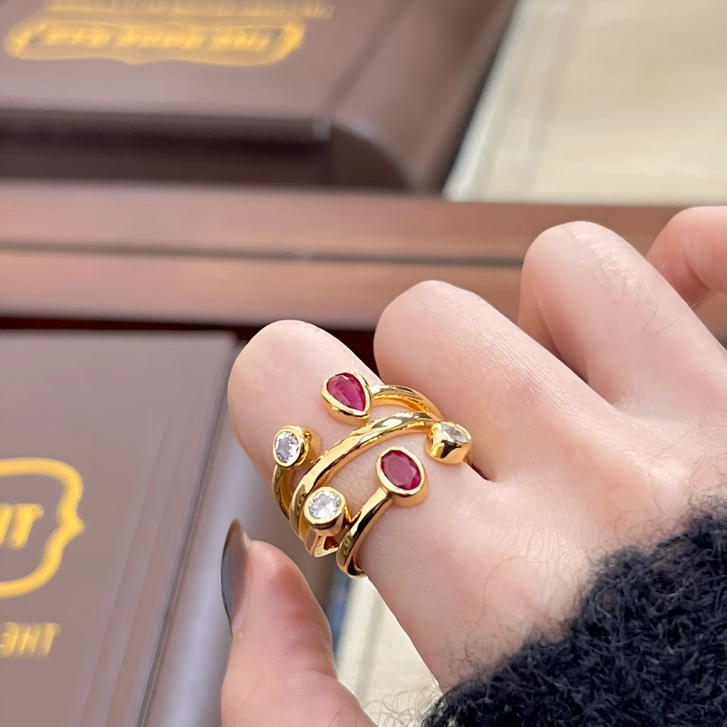 Double-headed copper ring with irregular cross shape and two-tone colour options.