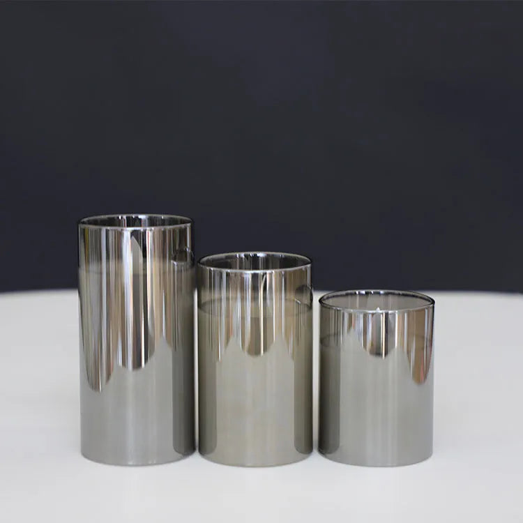 LED electronic remote control candle in cylindrical glass plating with warm yellow swinging flame