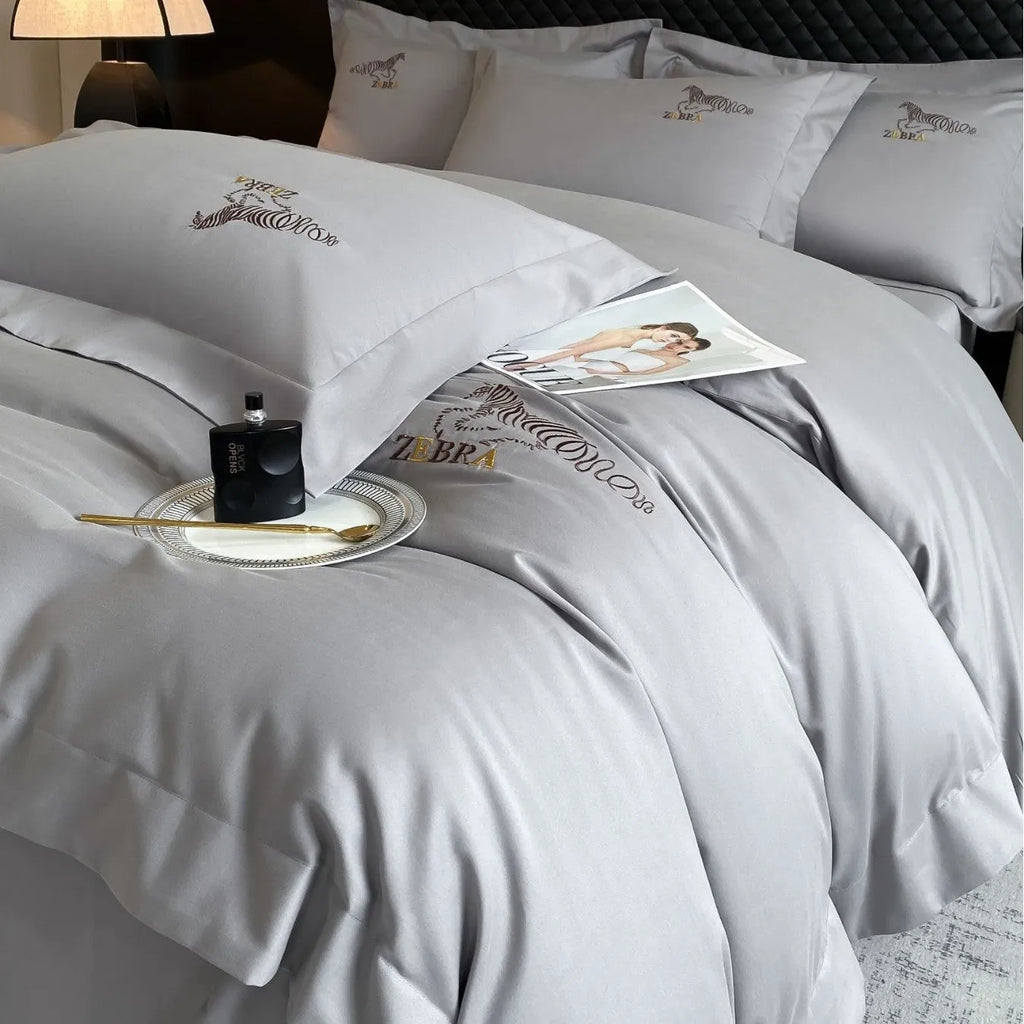 Solid colour pure cotton four-piece bedding set with light brushed finish on a bed in a modern bedroom
