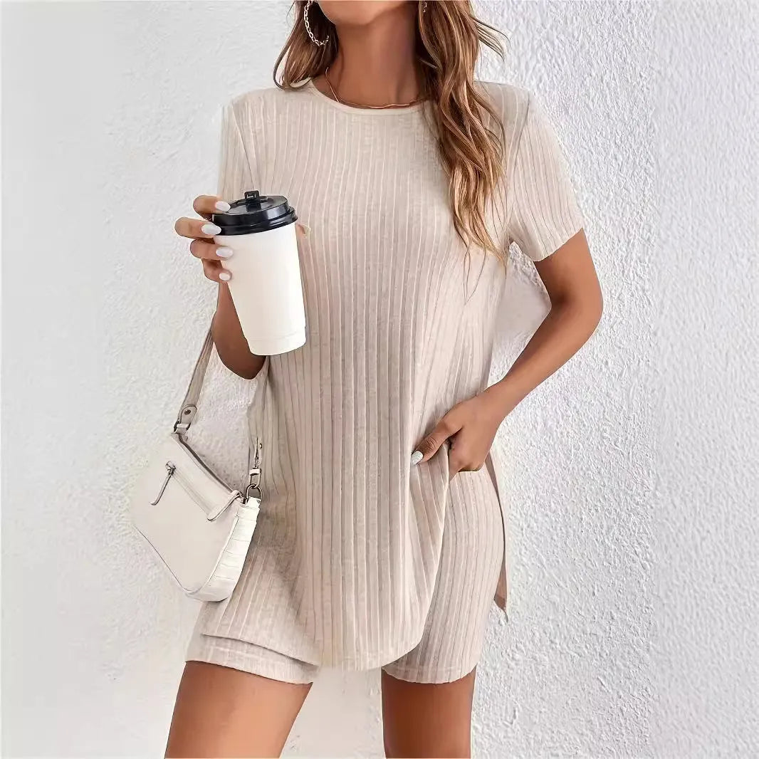 Women's black ribbed cotton shorts suit with crew neck top and matching shorts on a hanger.