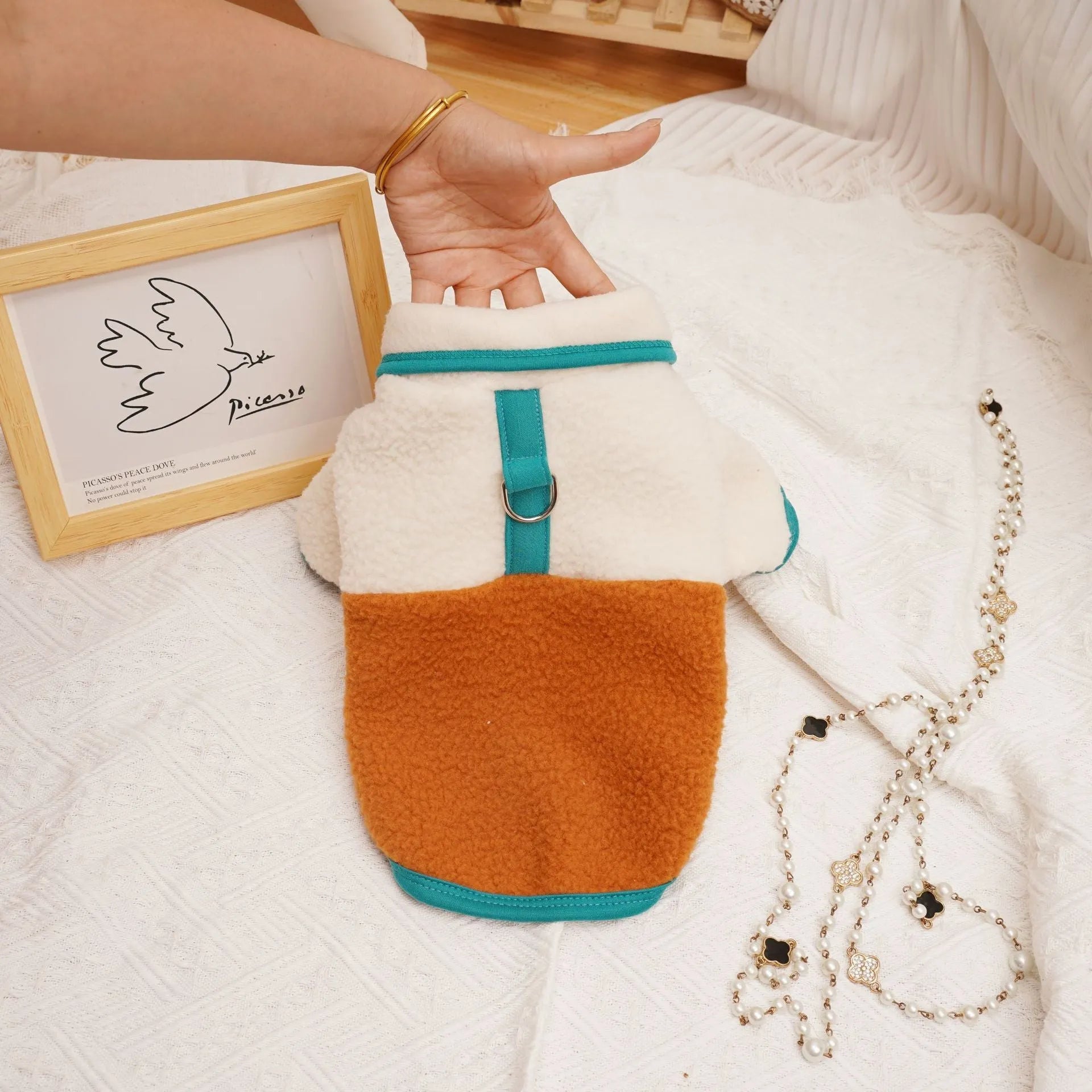 Lambswool fleece pet sweatshirt in caramel colour on a small dog.