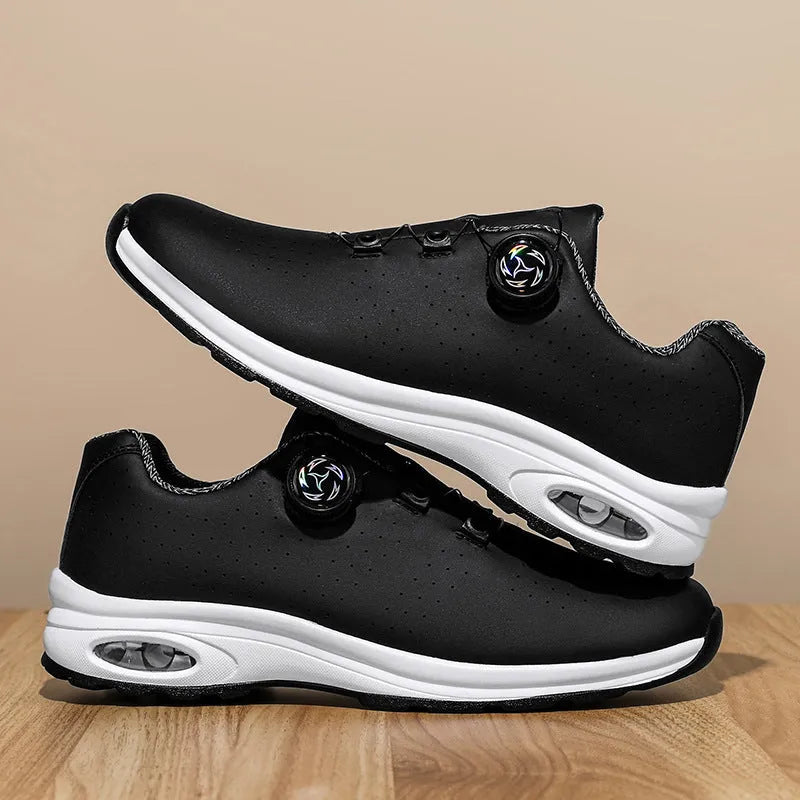 Pair of black low-top mesh tennis shoes with cross shoulder straps and white laces.