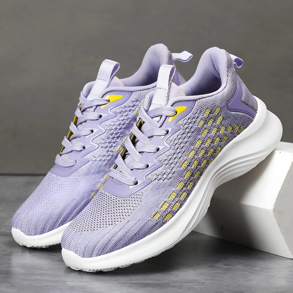 Women's lavender purple flyknit running shoes with mesh upper and striped pattern on a white background.