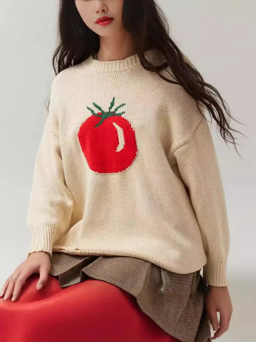 Women's beige acrylic jacquard loose-fitting pullover sweater with round neck and long sleeves.