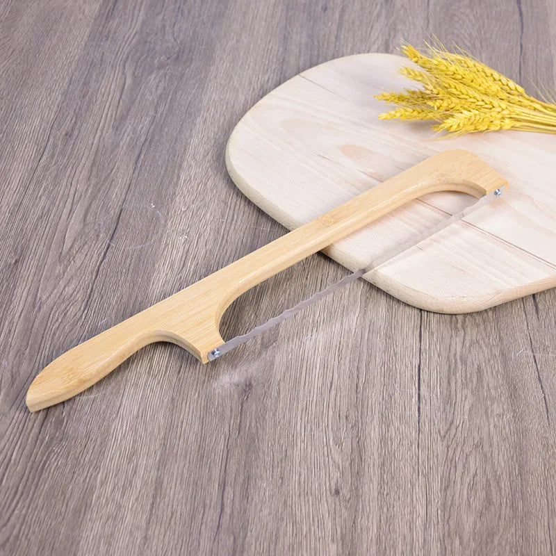 Wooden serrated bread knife 40cm with bending-resistant blade, wooden handle, shown slicing a wholemeal loaf