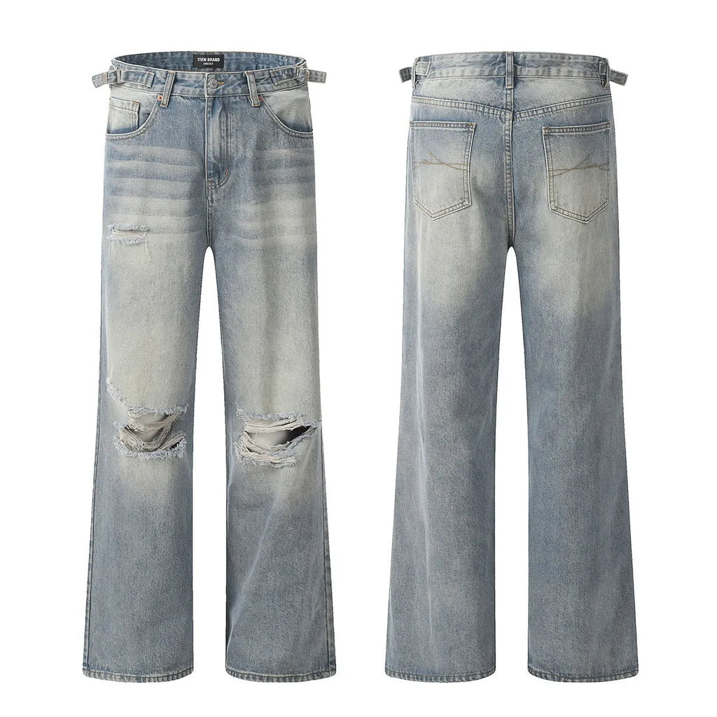 Blue men's straight-leg ripped jeans on a neutral background, showing zipper fly and cotton blend fabric texture.
