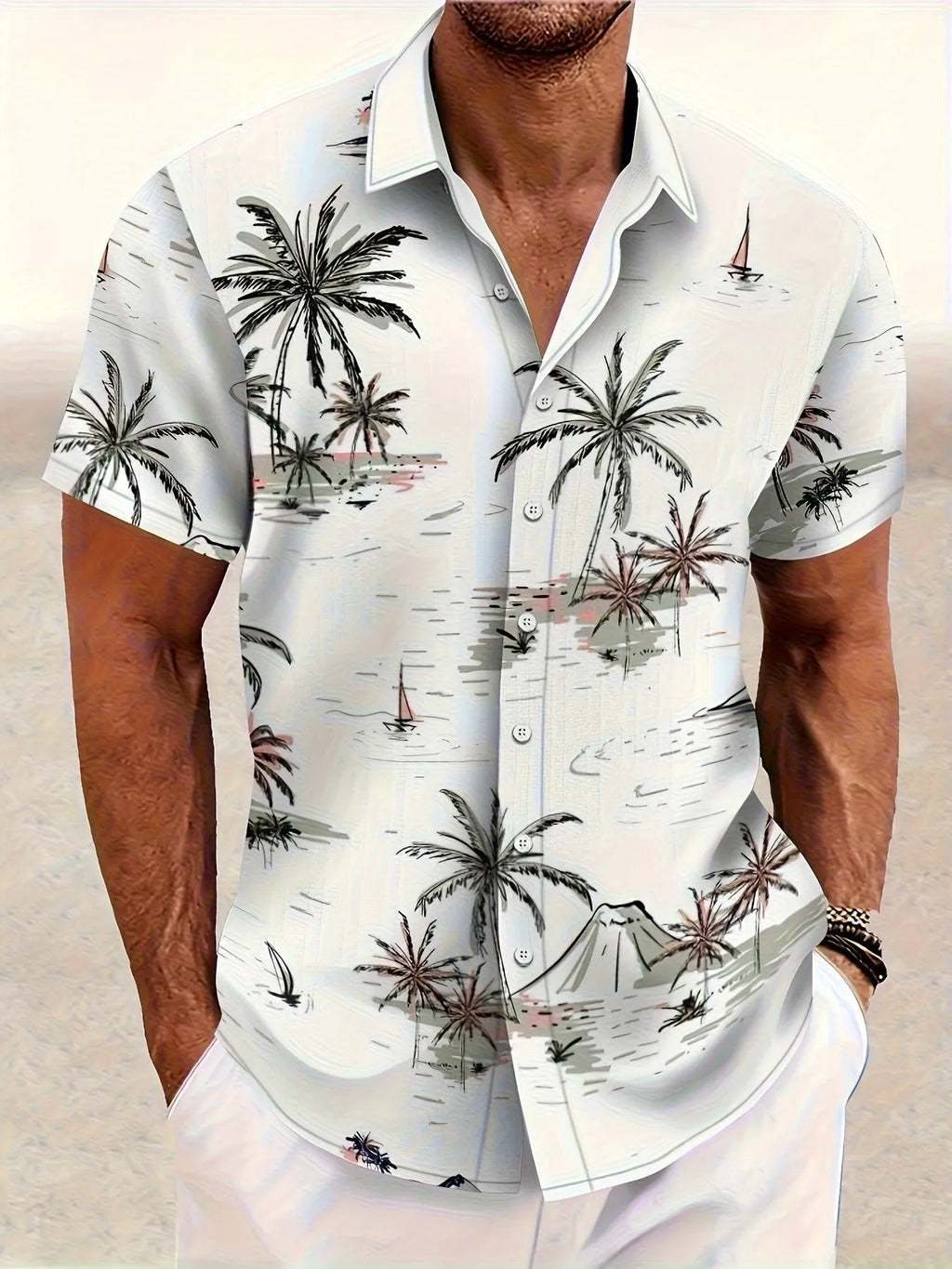 Man wearing a loose-fit floral print short sleeve cardigan-style shirt.