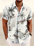 Man wearing a loose-fit floral print short sleeve cardigan-style shirt.
