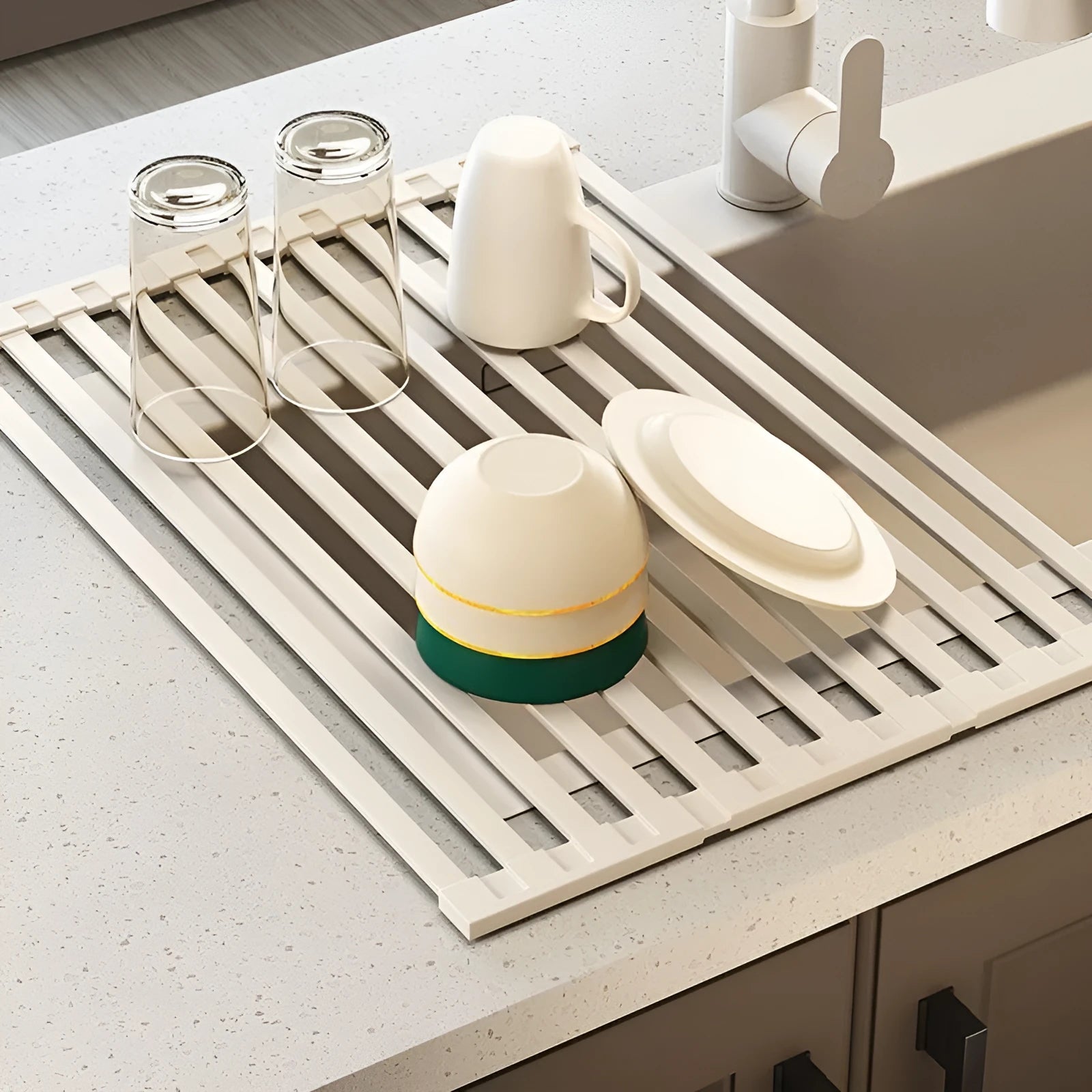 Milky white foldable stainless steel kitchen draining rack showing tri-fold mechanism