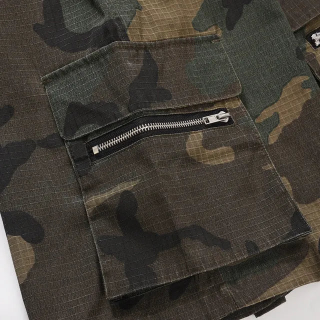 Man's green H215 camouflage cotton work shorts with multiple pockets shown in a loose fit.