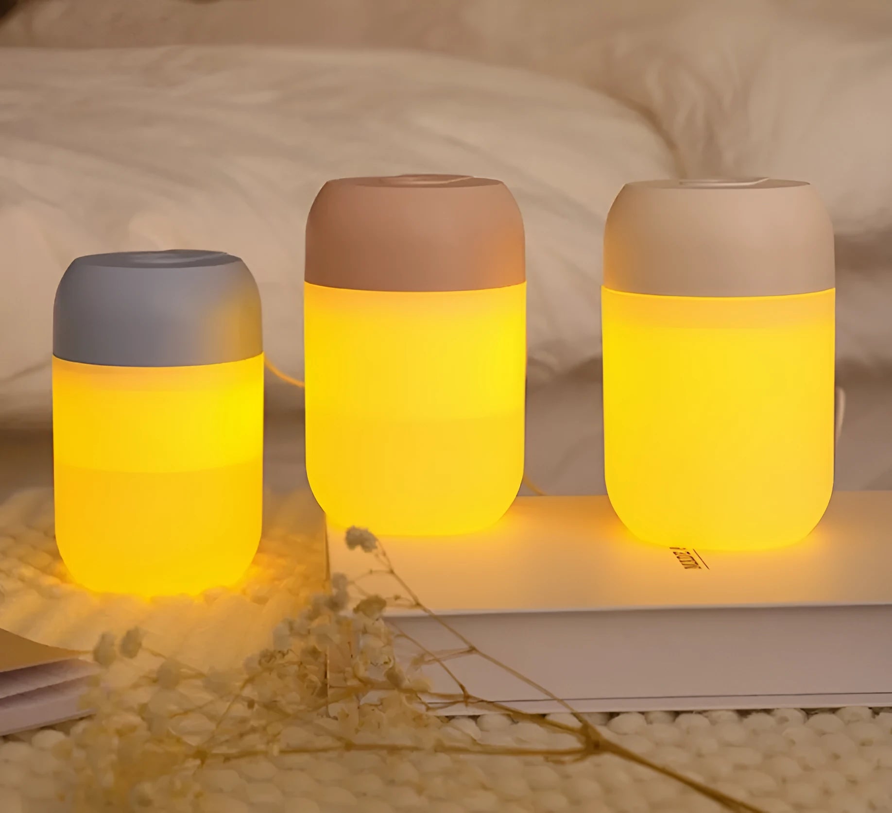 Small white cylindrical USB mini humidifier for desk or bedside use.